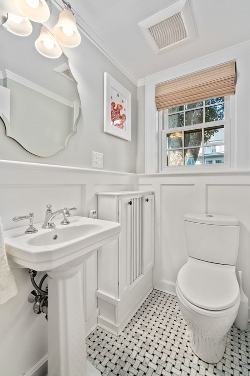115 Bright Road Belmont, MA 02478 - Photo 10 of 22 a bathroom with a sink a toilet and a mirror