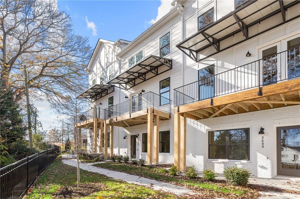 2490 Sycamore Road Northwest, Unit 51 Atlanta, GA 30318 - Photo 1 of 1 a view of a building with street