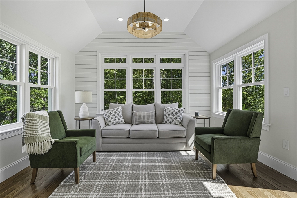 14 Waterville Lane, Unit 14 Hopkinton, MA 01748 - Photo 12 of 33 a living room with furniture and a large window