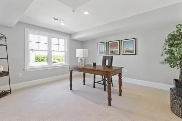 a workspace with furniture and window