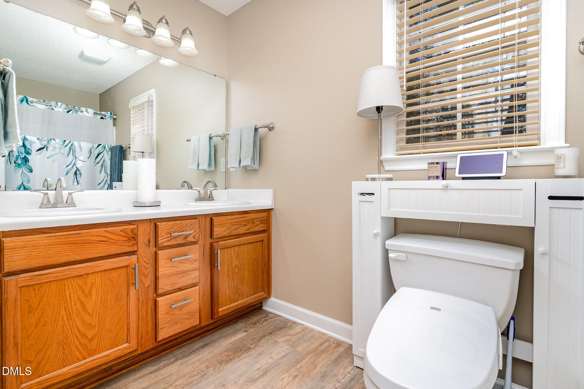 3205 Terrel Mill Road Raleigh, NC 27616 - Photo 13 of 26 a bathroom with a toilet sink and mirror