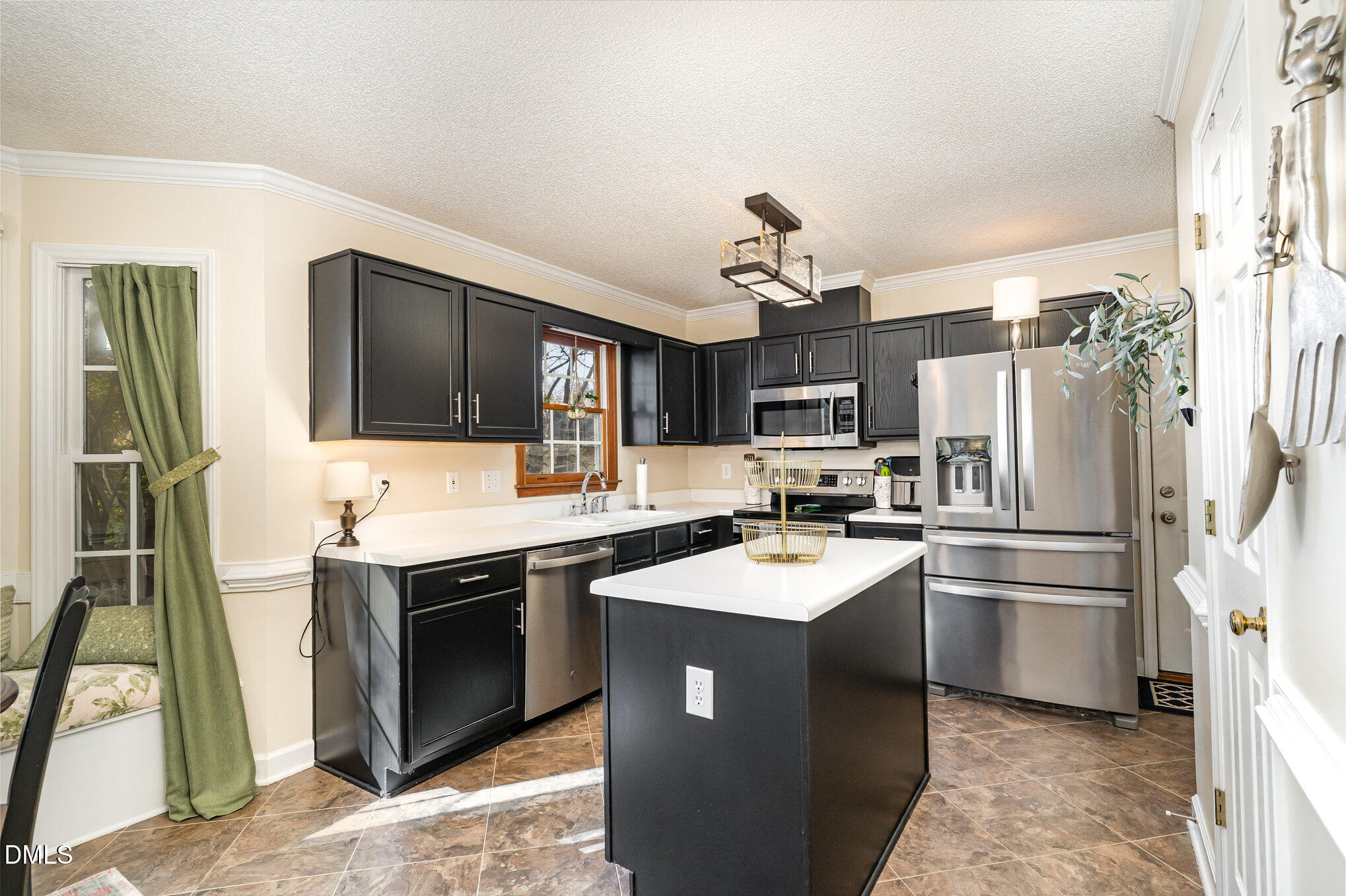 3205 Terrel Mill Road Raleigh, NC 27616 - Photo 7 of 26 a kitchen with stainless steel appliances a sink stove and refrigerator
