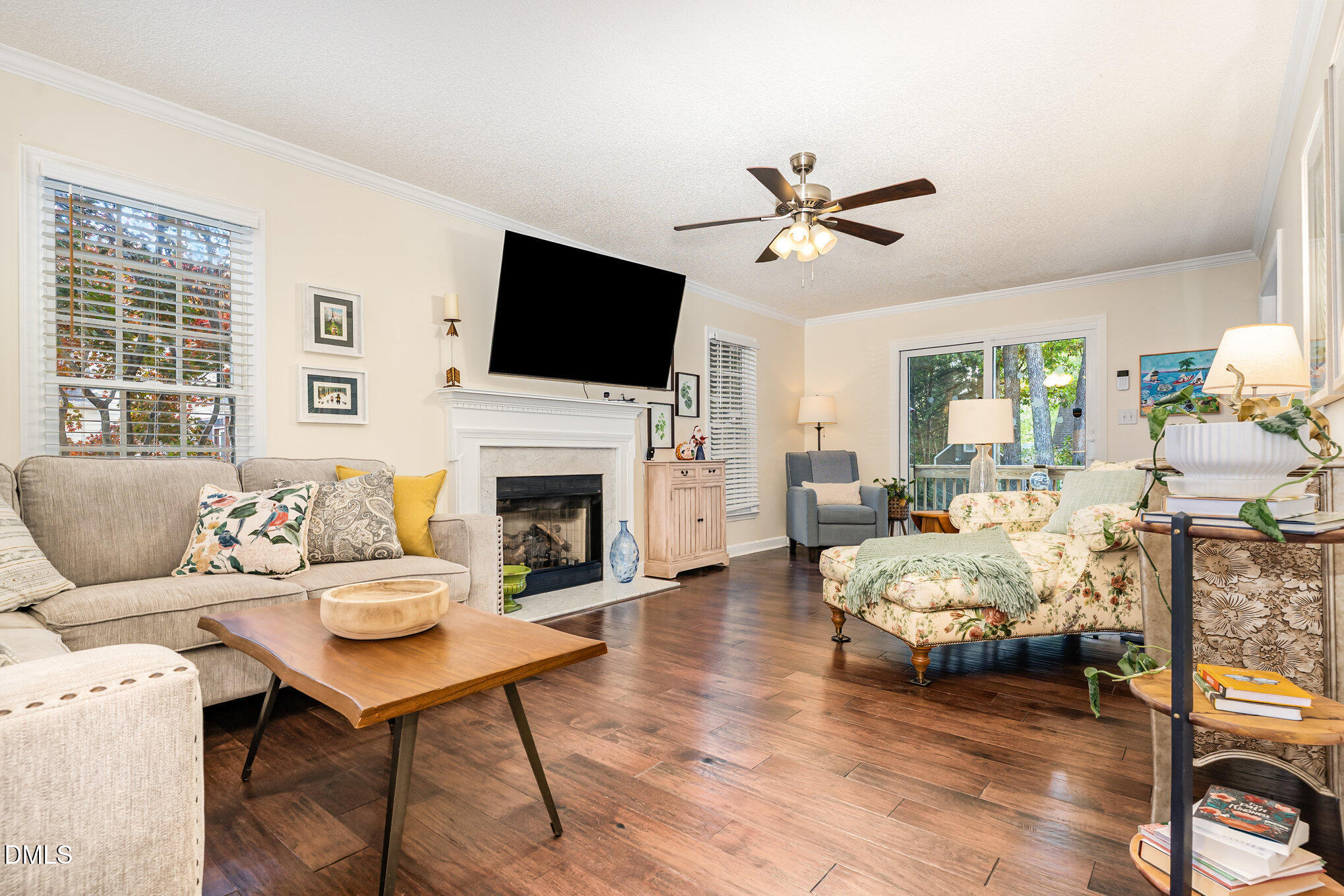 3205 Terrel Mill Road Raleigh, NC 27616 - Photo 8 of 26 a living room with furniture fireplace and a flat screen tv
