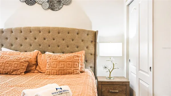 a bathroom with a granite countertop sink a large mirror and a bathtub