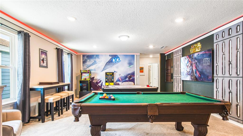 7219 Oakmoss Loop Davenport, FL 33837 - Photo 20 of 54 a living room with furniture and a flat screen tv