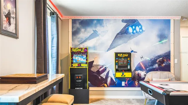 a room with furniture and pool table