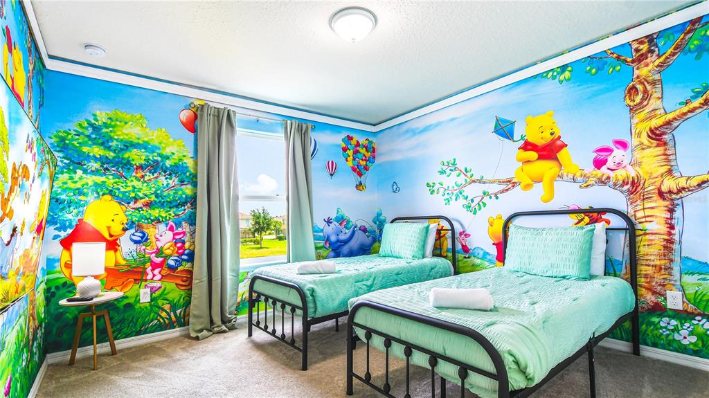 7219 Oakmoss Loop Davenport, FL 33837 - Photo 27 of 54 a living room filled with furniture