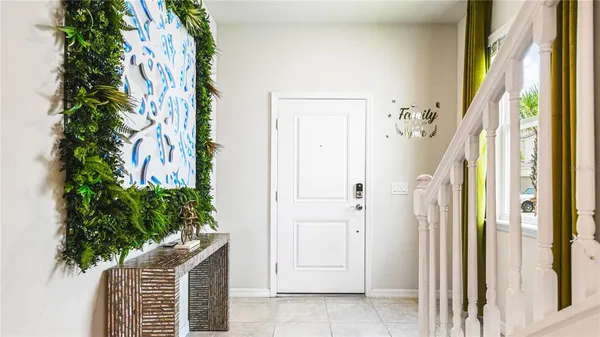 a bathroom with a potted plant and a shower curtain