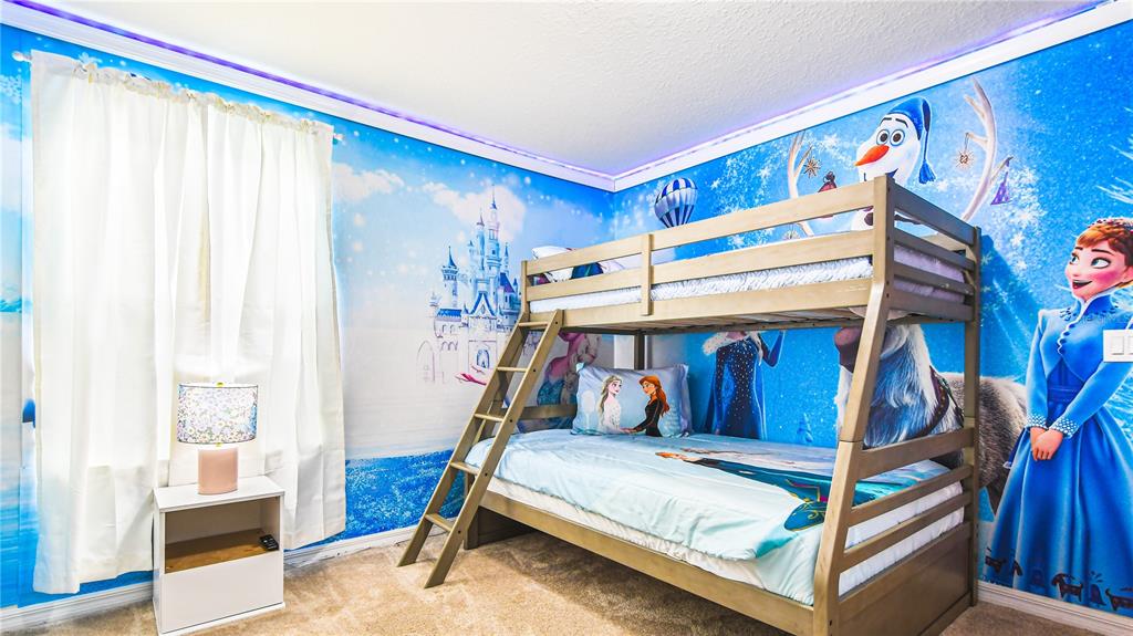 7219 Oakmoss Loop Davenport, FL 33837 - Photo 33 of 54 a bed room with a bed and a window