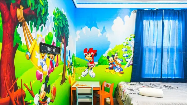 a bedroom with a bed and window