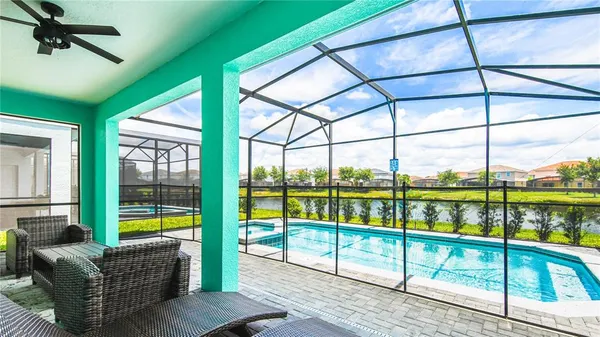 a view of swimming pool with patio