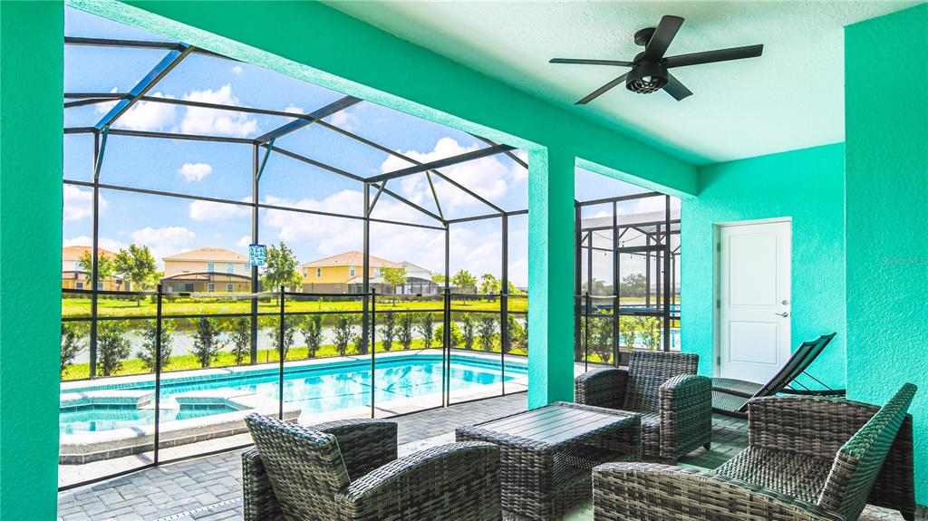7219 Oakmoss Loop Davenport, FL 33837 - Photo 50 of 54 a living room with furniture and a large window