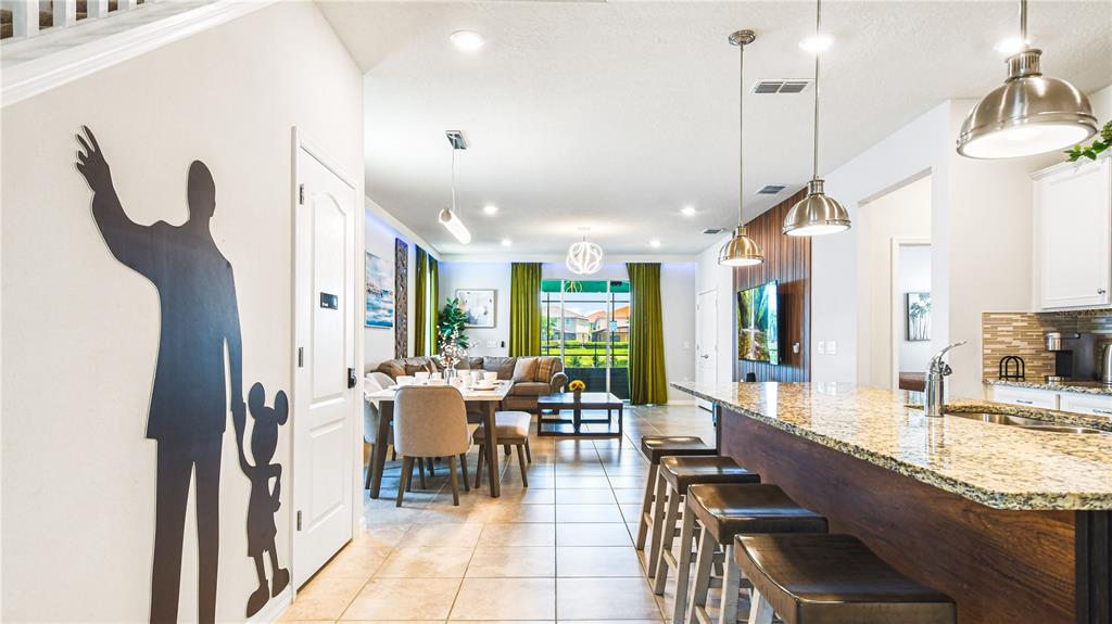 7219 Oakmoss Loop Davenport, FL 33837 - Photo 5 of 54 a very nice looking dining room with a large window