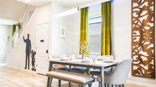a view of a dining room with furniture and a window