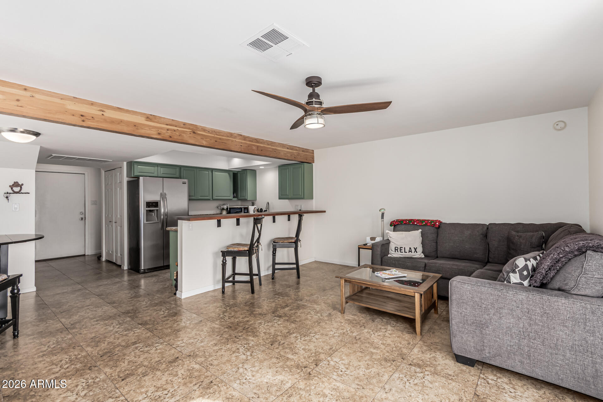 6040 North 15th Street, Unit 27 Phoenix, AZ 85014 - Photo 2 of 28 a living room with furniture and a ceiling fan