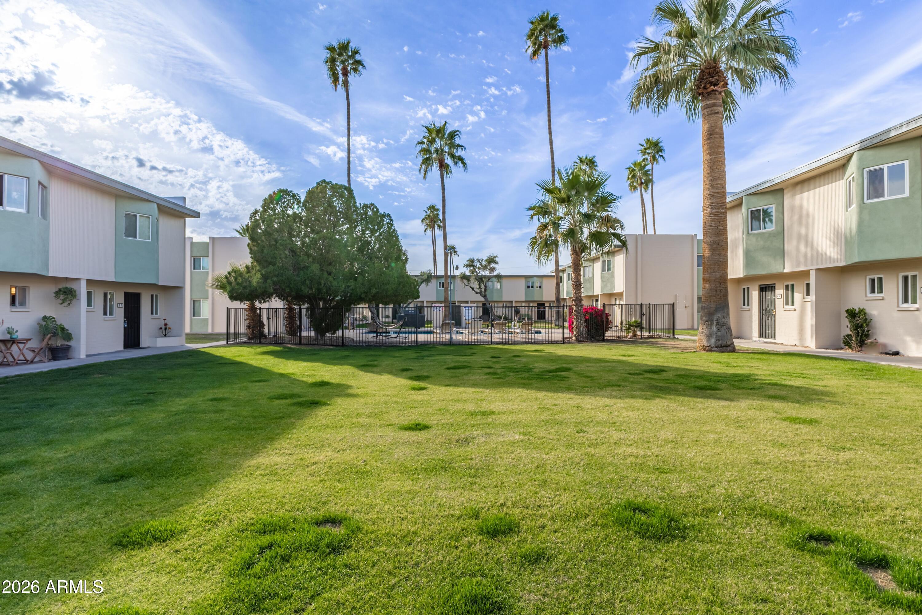 6040 North 15th Street, Unit 27 Phoenix, AZ 85014 - Photo 22 of 28 a garden view with a fountain in front of it