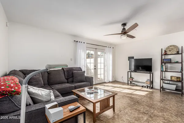 a living room with furniture and a flat screen tv