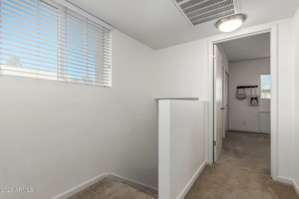 a view of a hallway with a room