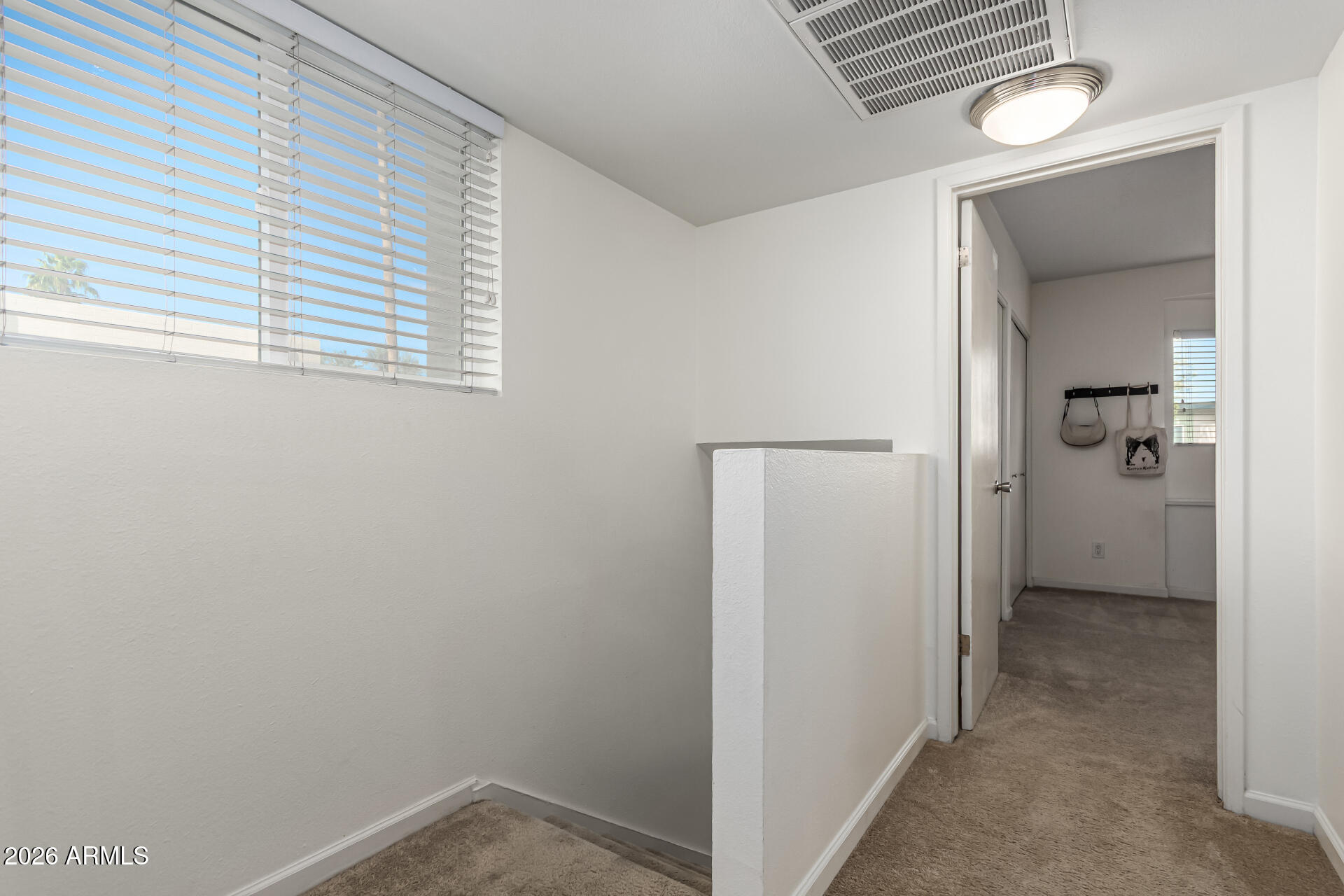 6040 North 15th Street, Unit 27 Phoenix, AZ 85014 - Photo 9 of 28 a view of a hallway with a room