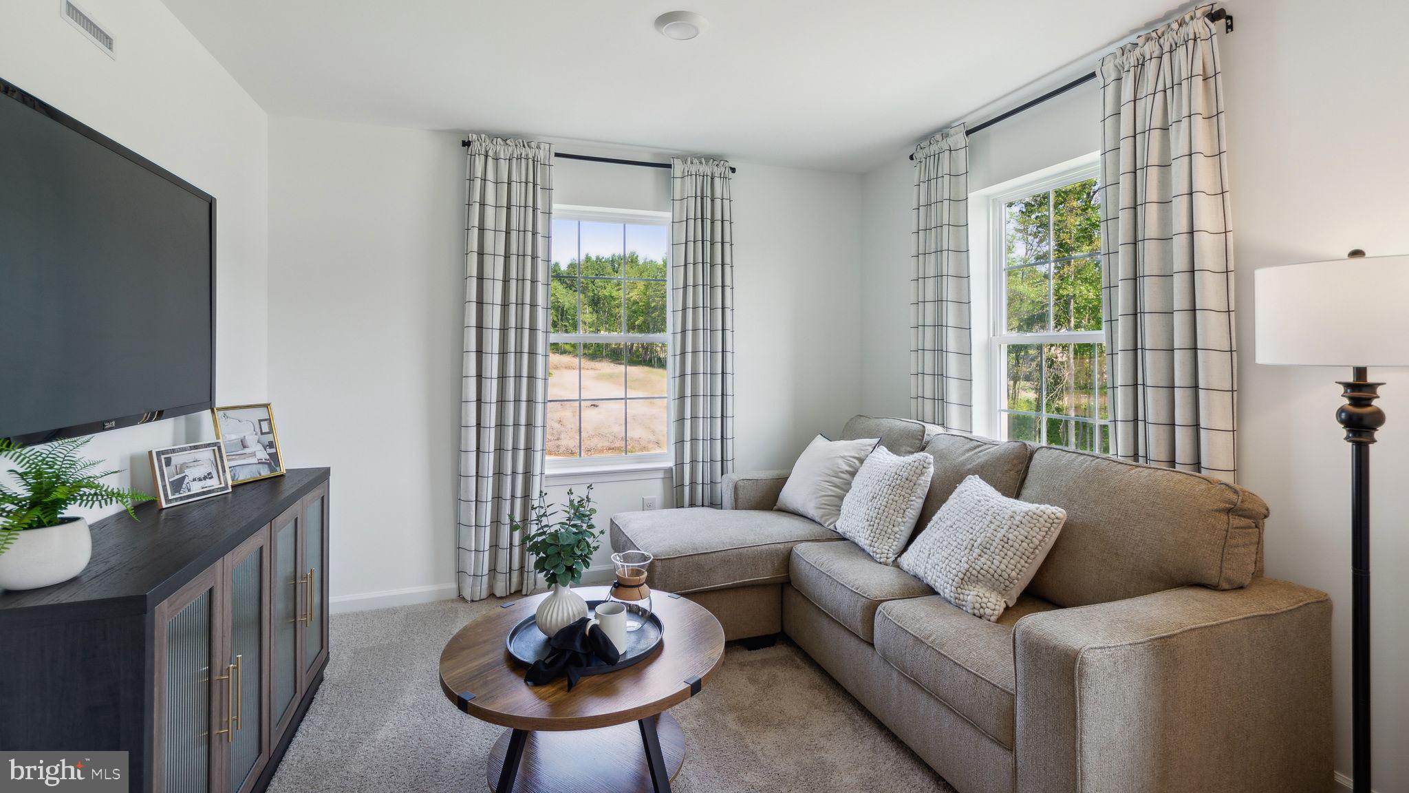 453 Clems Run Mullica Hill, NJ 08062 - Photo 24 of 35 a living room with furniture and a flat screen tv