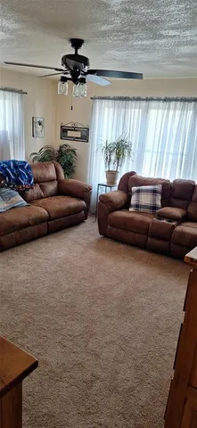 a view of a kitchen with a sink and cabinets