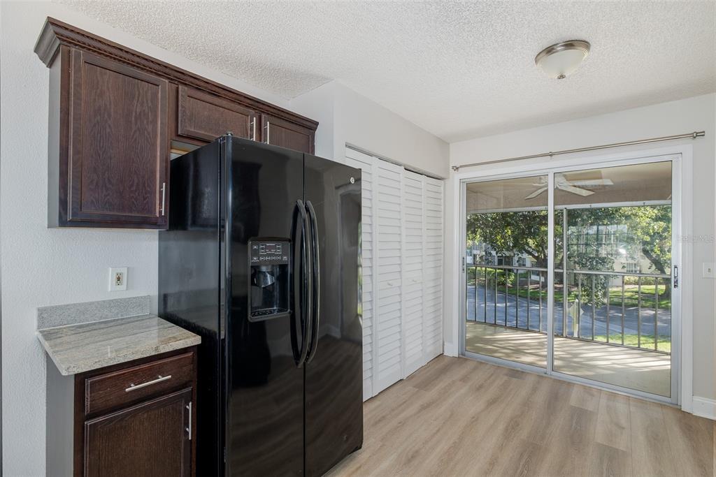 7900 Hardwick Drive, Unit 827 New Port Richey, FL 34653 - Photo 10 of 27 a kitchen with stainless steel appliances granite countertop a refrigerator and a sink
