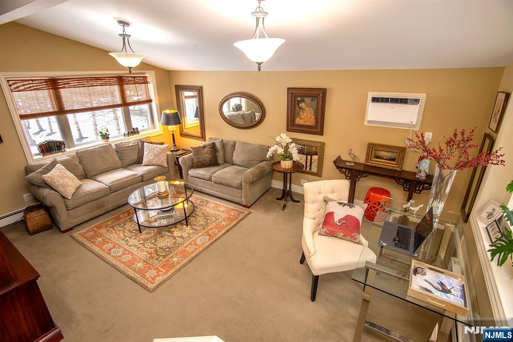 25 Maple Avenue Demarest, NJ 07627 - Photo 12 of 29 a living room with fireplace furniture and a window
