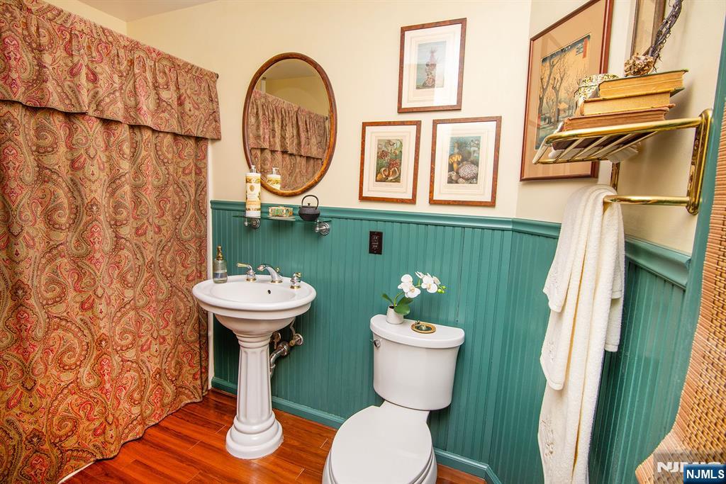 25 Maple Avenue Demarest, NJ 07627 - Photo 22 of 29 a bathroom with a sink toilet and a mirror