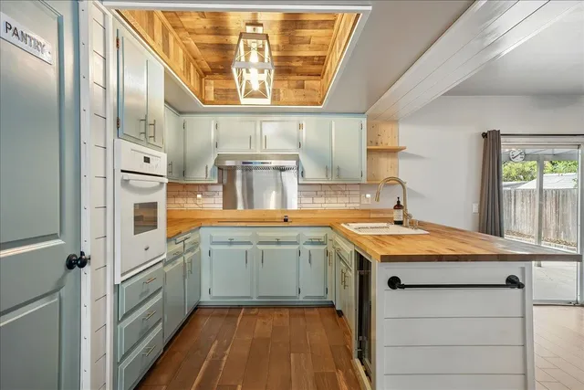 a kitchen with a sink and a window