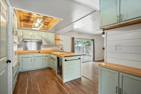 a kitchen with a stove and a window