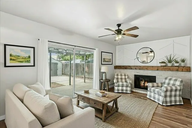 a living room with furniture and a fireplace