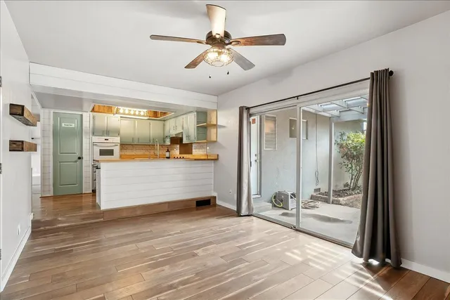 a view of a room with cabinet and mirrors