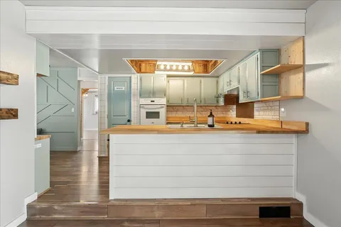 a view of living room with granite countertop furniture and a fireplace