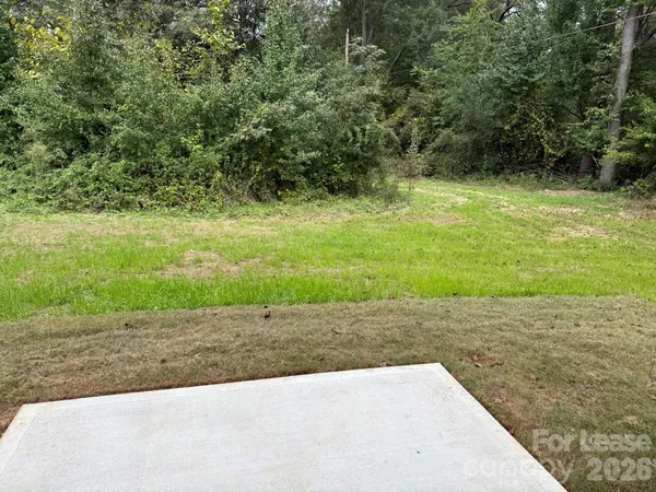 a view of a pathway with a yard