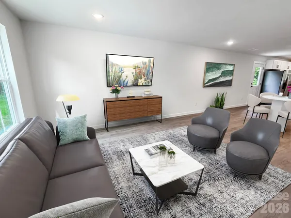 a living room with furniture rug and window