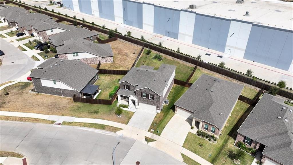 1201 Timberhurst Trail Fort Worth, TX 76131 - Photo 36 of 40 Aerial perspective showcasing multiple residential properties with gray shingle roofs