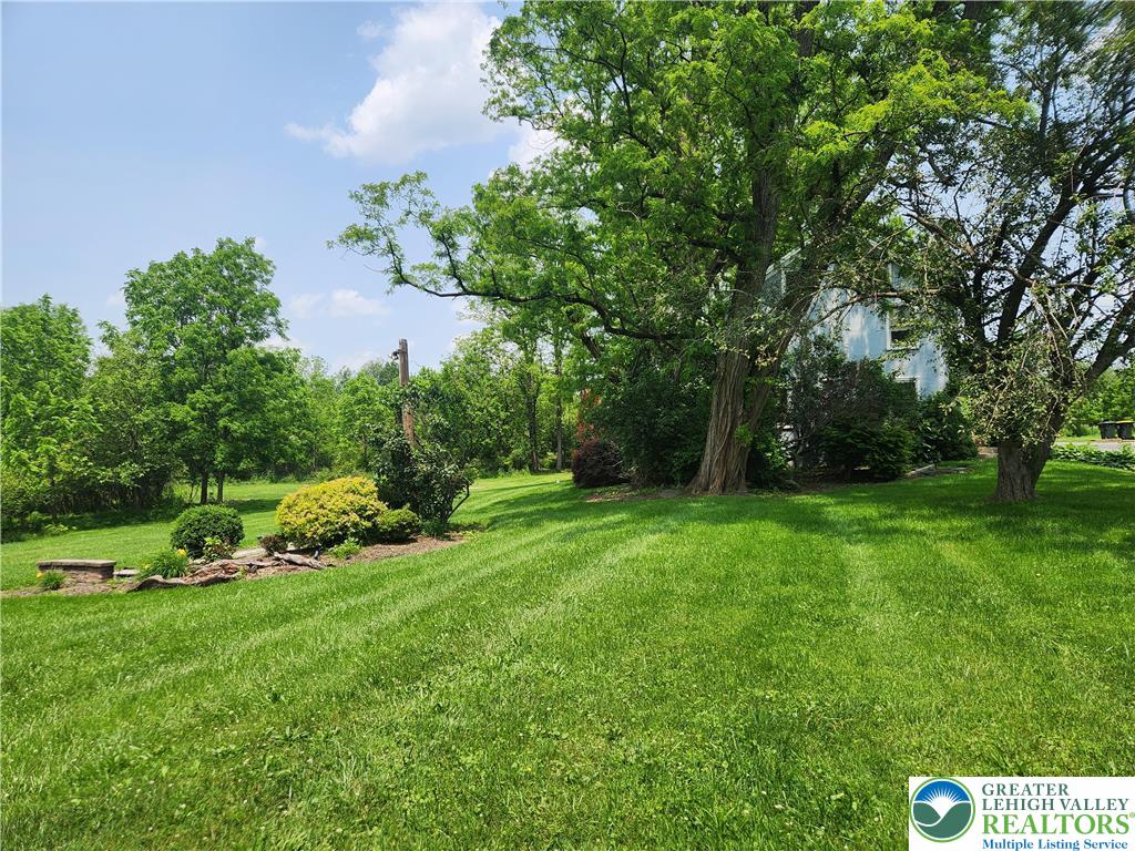 717 Point Phillips Road Bath, PA 18014 - Photo 11 of 34 a view of a green field with trees in the background
