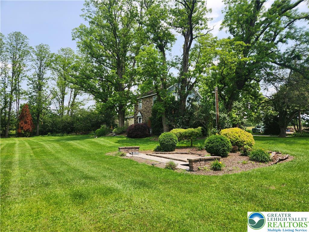 717 Point Phillips Road Bath, PA 18014 - Photo 13 of 34 a backyard of a house with outdoor seating