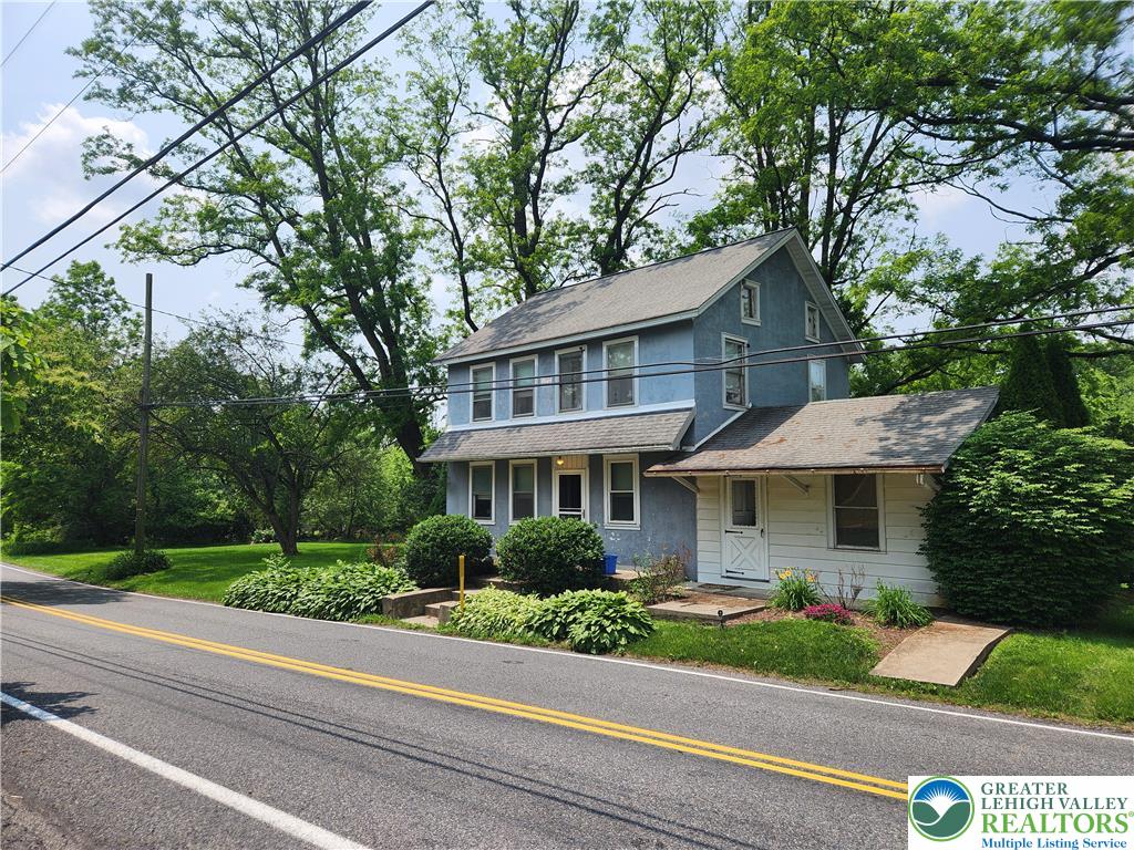 717 Point Phillips Road Bath, PA 18014 - Photo 2 of 34 a front view of a house with a yard