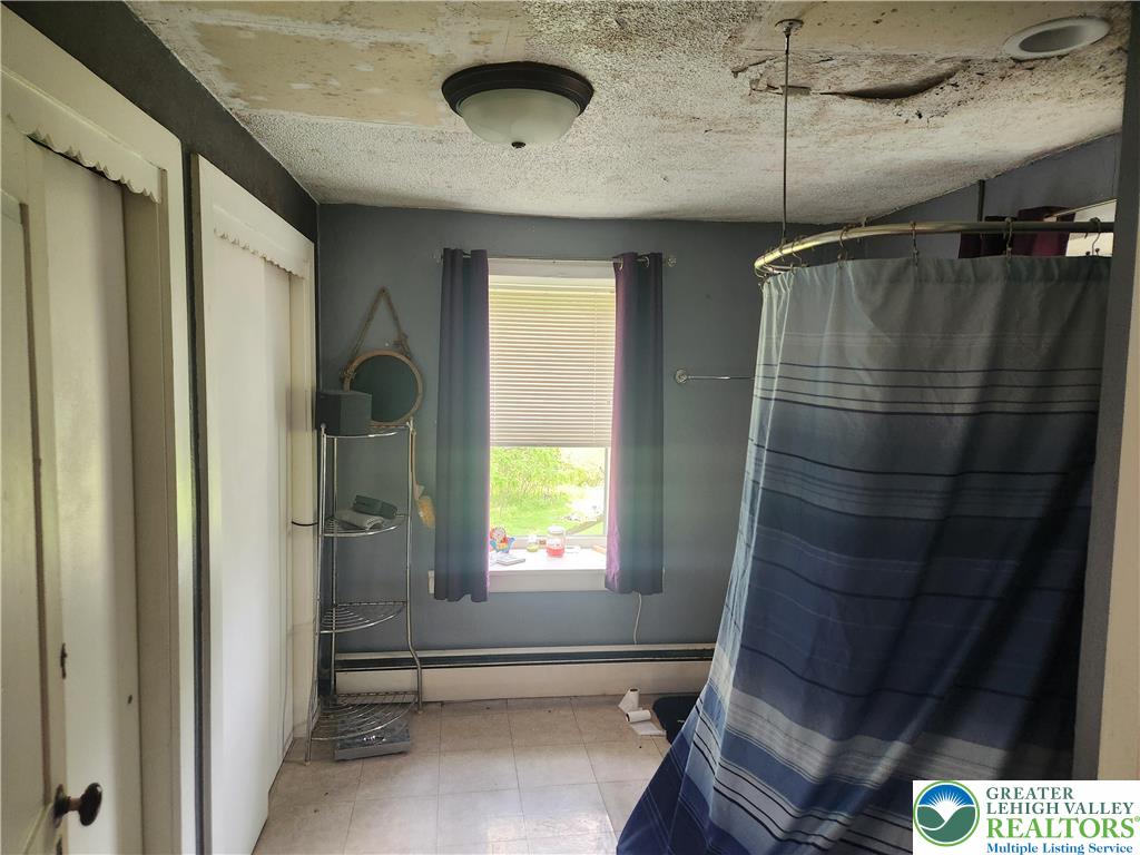 717 Point Phillips Road Bath, PA 18014 - Photo 27 of 34 a bathroom with a sink and a shower