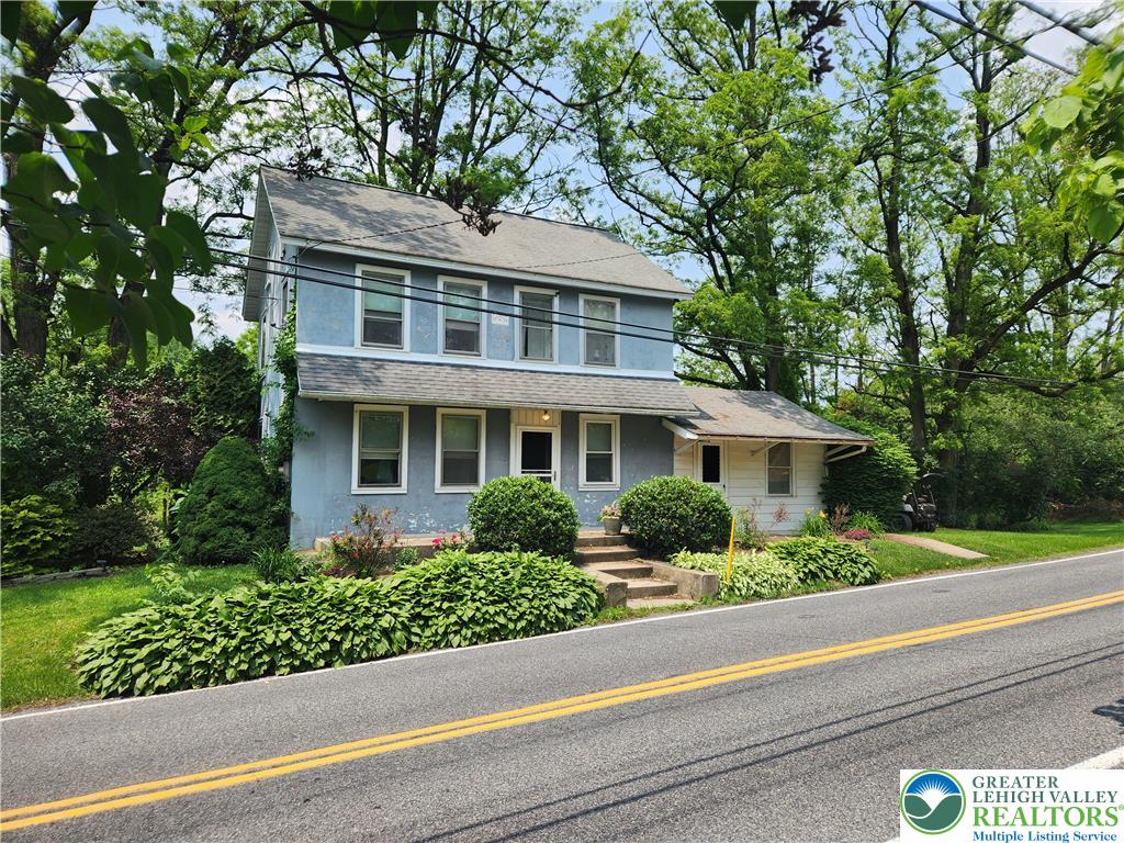 717 Point Phillips Road Bath, PA 18014 - Photo 8 of 34 a front view of a house with a yard