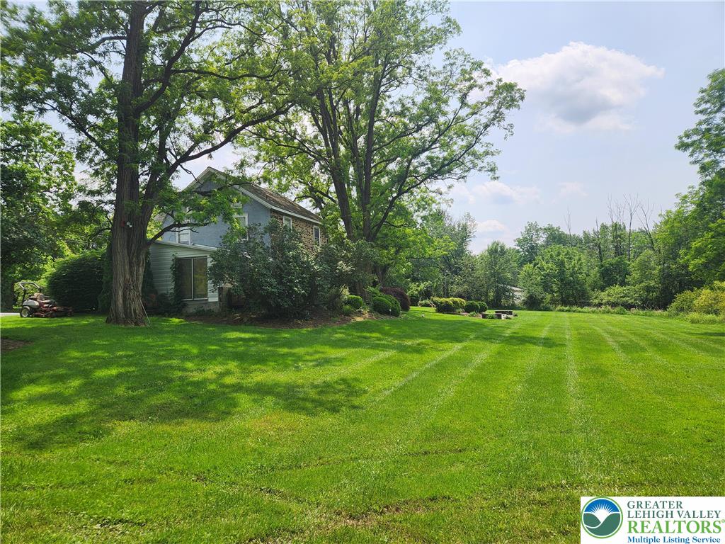 717 Point Phillips Road Bath, PA 18014 - Photo 9 of 34 a view of a grassy field with trees in the background