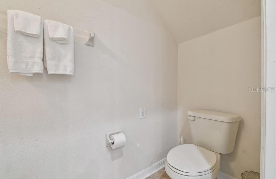 11523 84th St Circle East, Unit 106 Parrish, FL 34219 - Photo 11 of 27 a white toilet sitting next to a shower