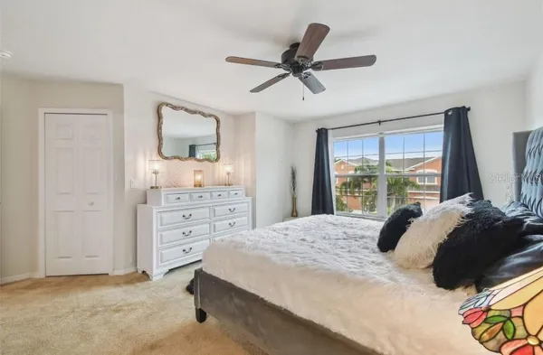 a bedroom with a bed and a dresser