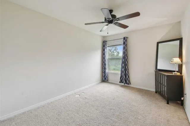 a view of a livingroom with a ceiling fan