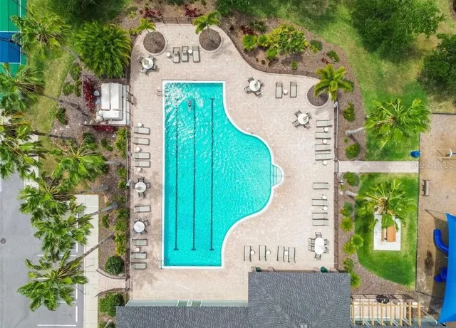 a view of a door with a fountain and plants