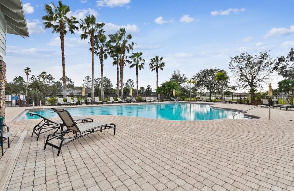 11523 84th St Circle East, Unit 106 Parrish, FL 34219 - Photo 27 of 27 a view of a lake with a table and chairs