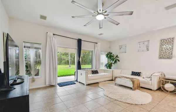 a living room with furniture and a large window