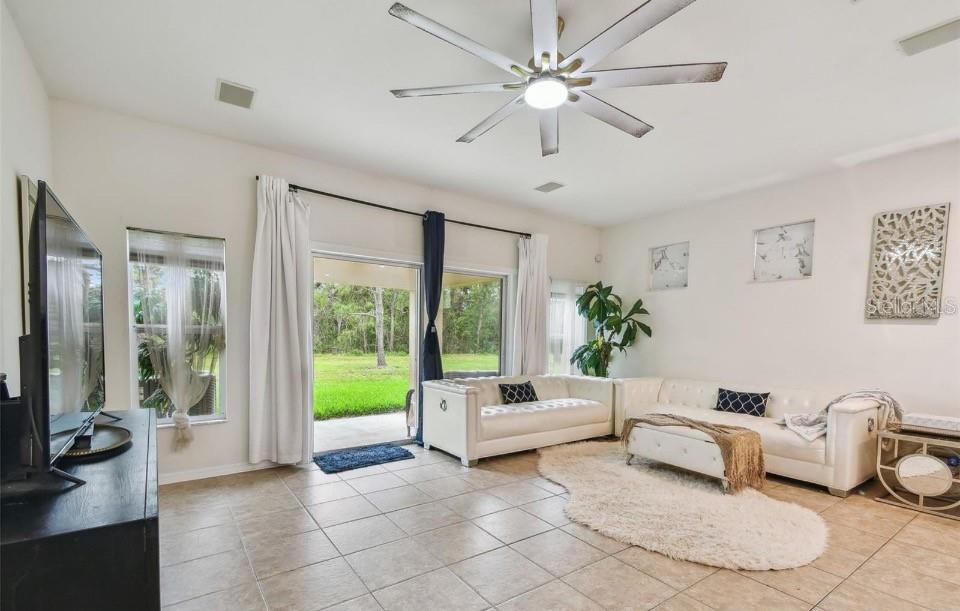 11523 84th St Circle East, Unit 106 Parrish, FL 34219 - Photo 9 of 27 a living room with furniture and a large window