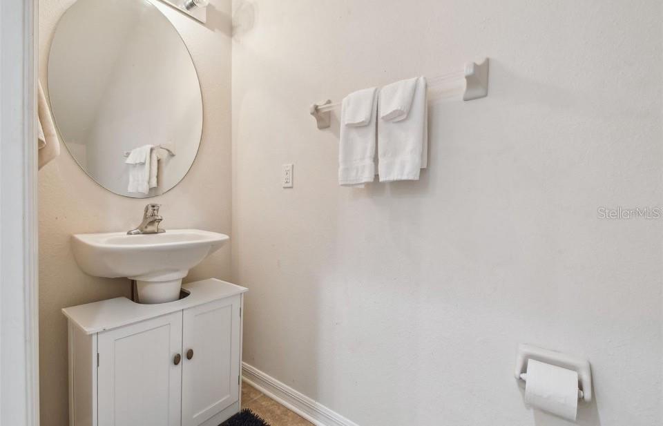 11523 84th St Circle East, Unit 106 Parrish, FL 34219 - Photo 10 of 27 a bathroom with a sink a mirror and a toilet